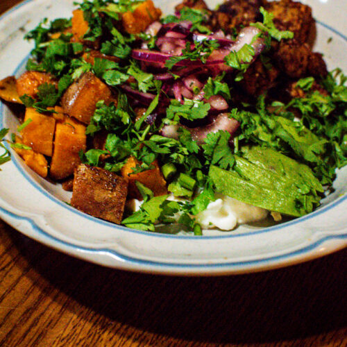 BBQ grilled sweet potato foil packet bowl with cottage cheese, crispy tempeh, avocado, and pickled red onion