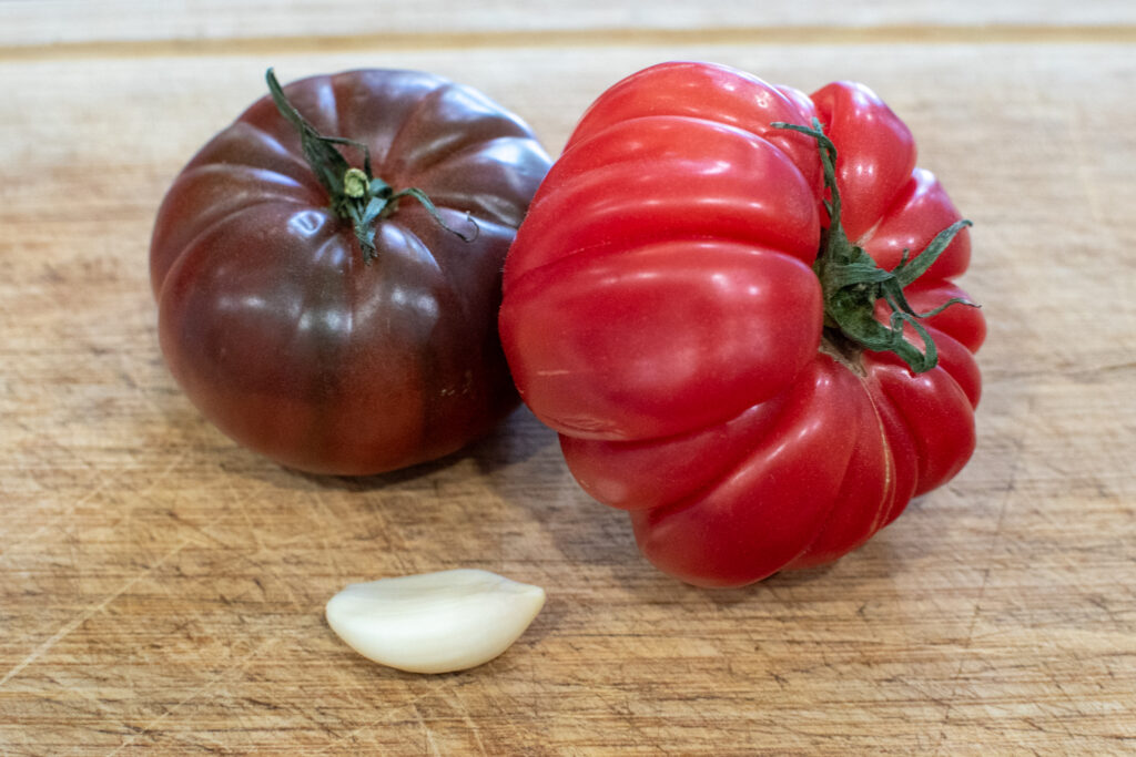 high protein summer sandwich with burrata and heirloom tomato on garlic focaccia
